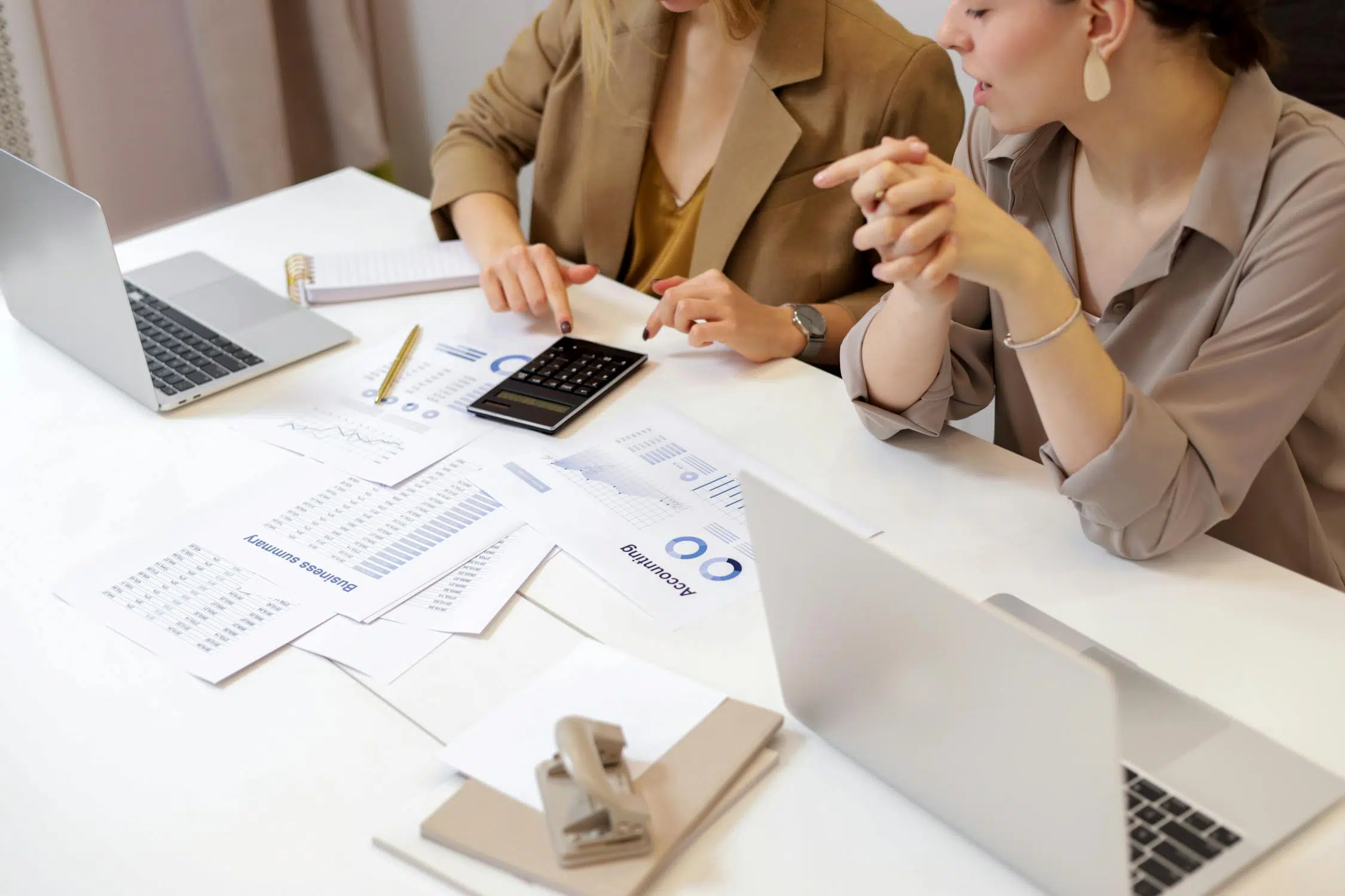 two business women working on financial forecasting of their business