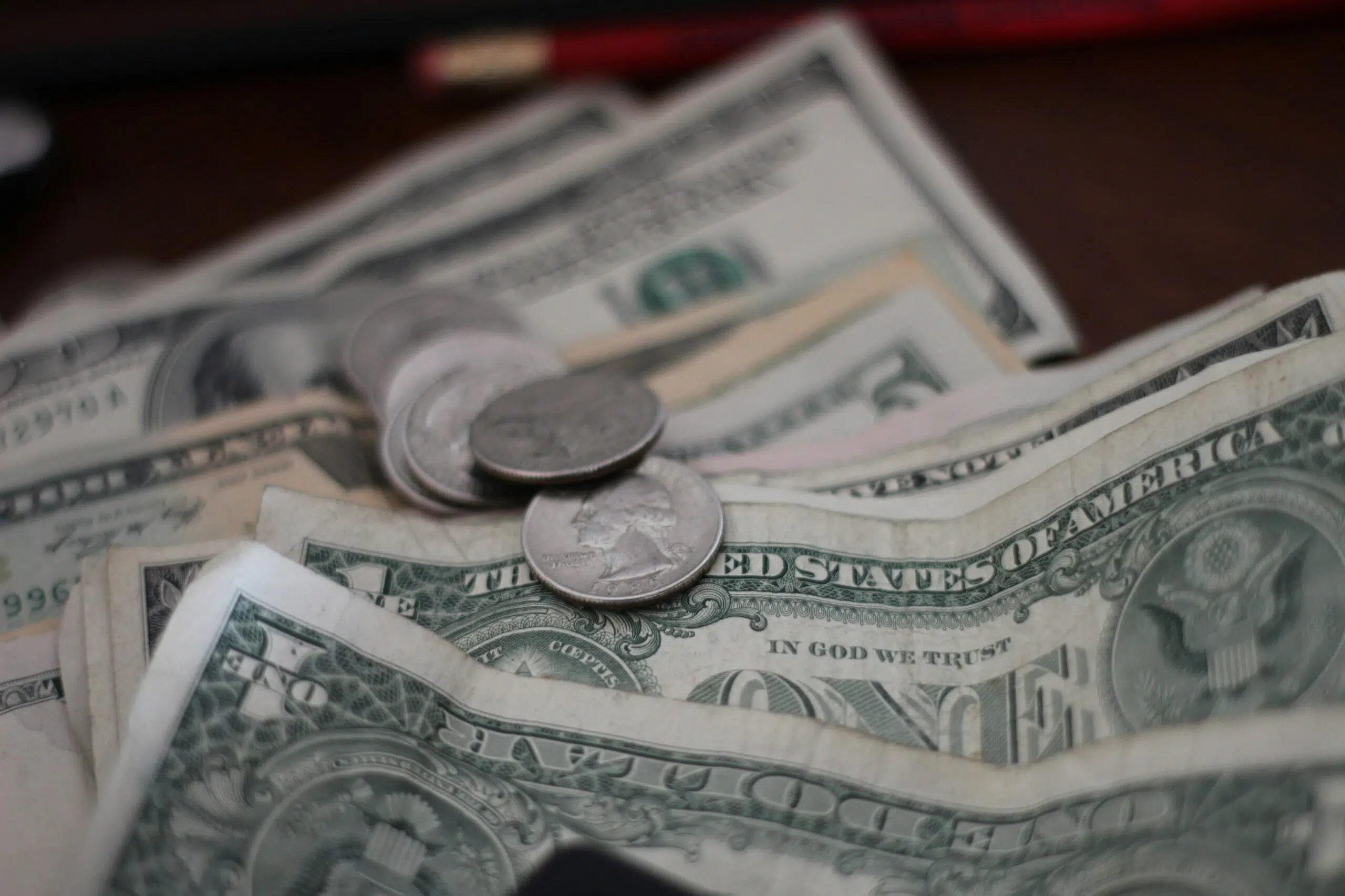 dollars and coins on a table