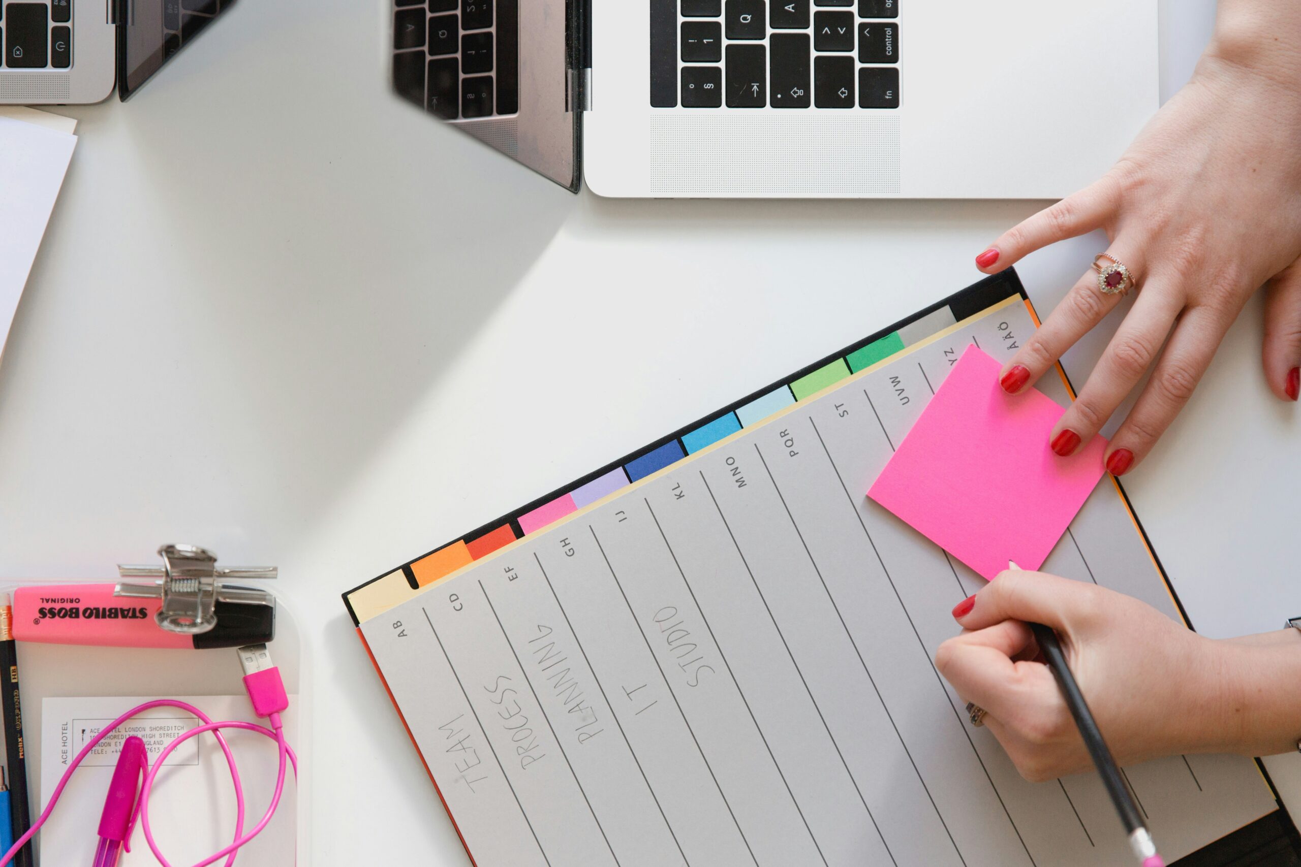 a person writing something in a sticky note | Cohesion a person writing something in a sticky note