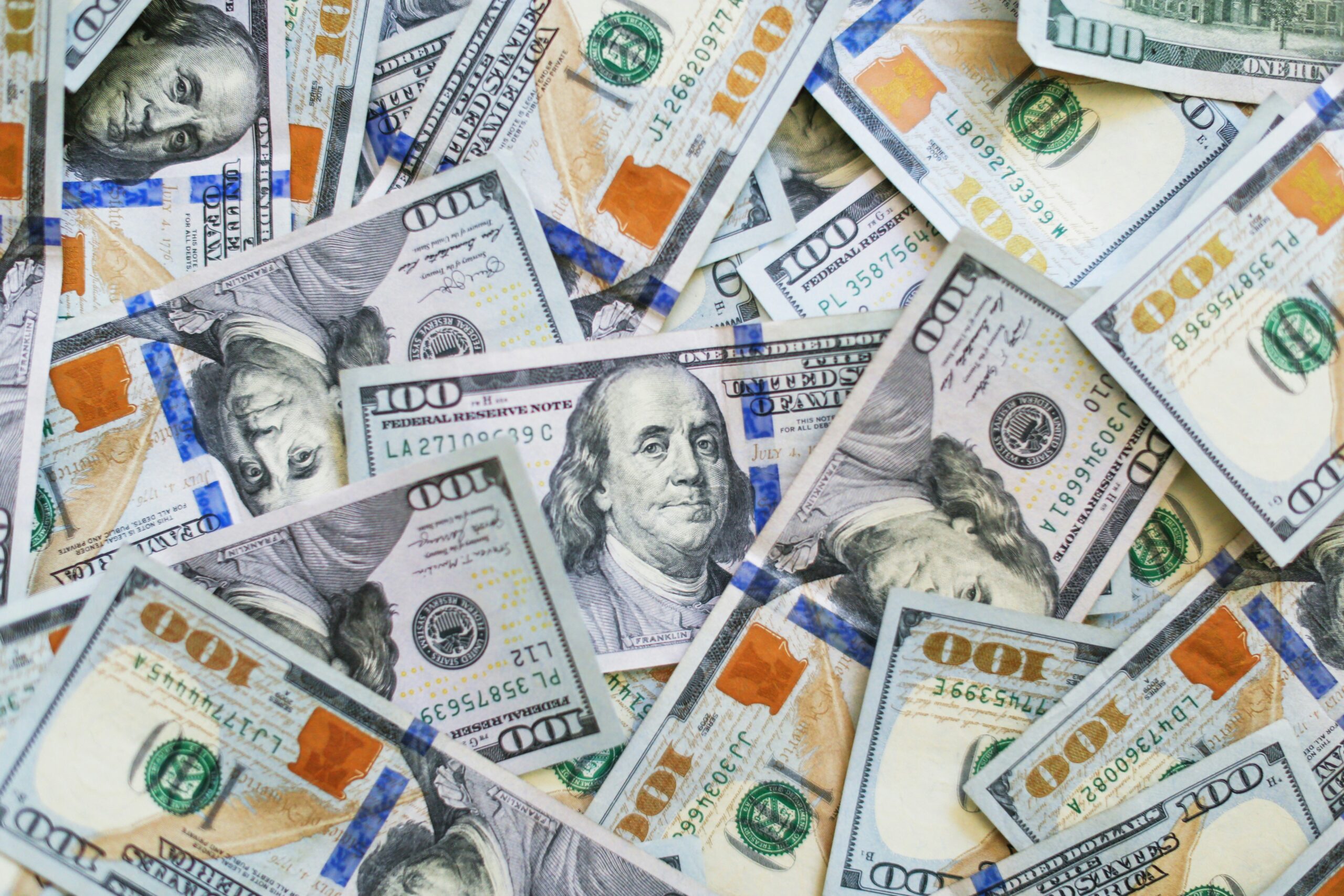 piles of 100 dollar bills | Cohesion piles of 100 dollar bills