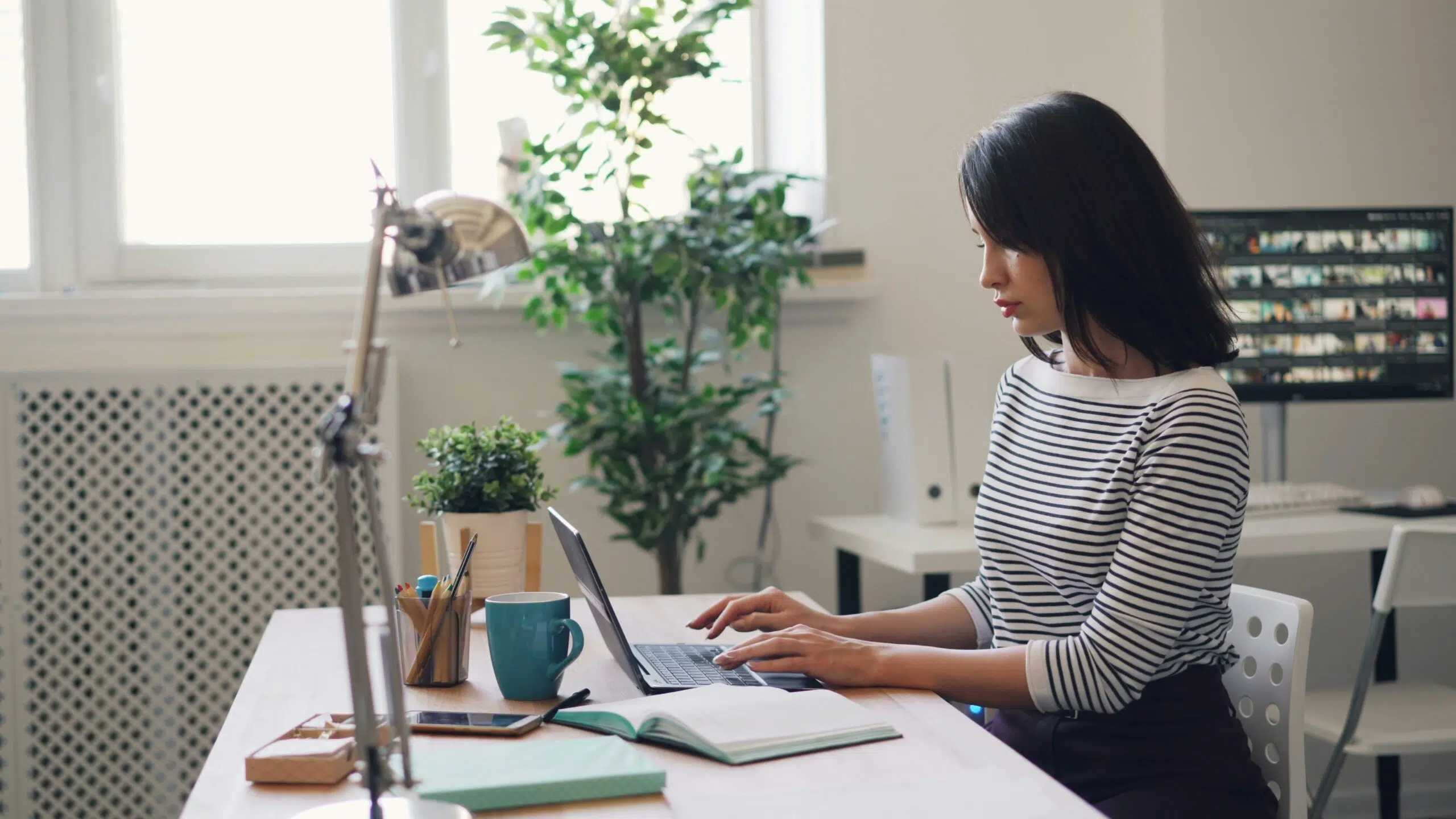 a business owner working on their laptop | Cohesion a business owner working on their laptop