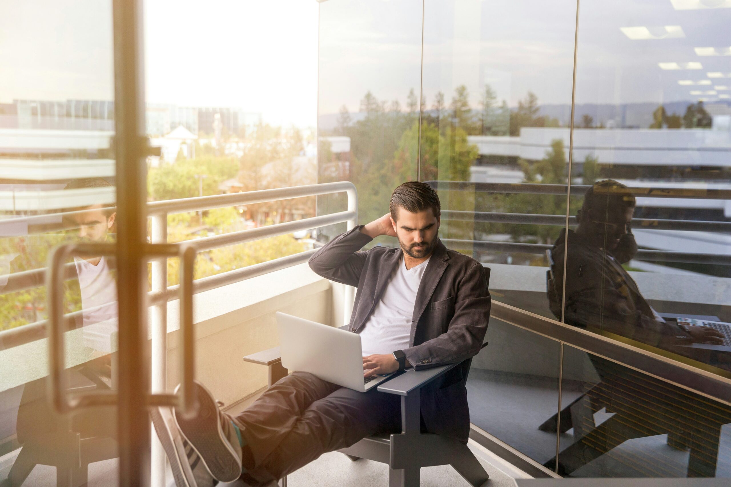 a business owner working on a laptop | Cohesion a business owner working on a laptop