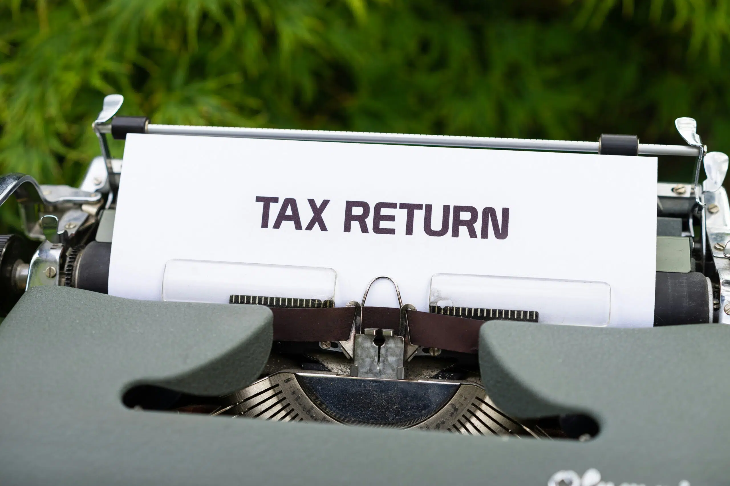 a type writer that says tax return | Cohesion a type writer that says tax return