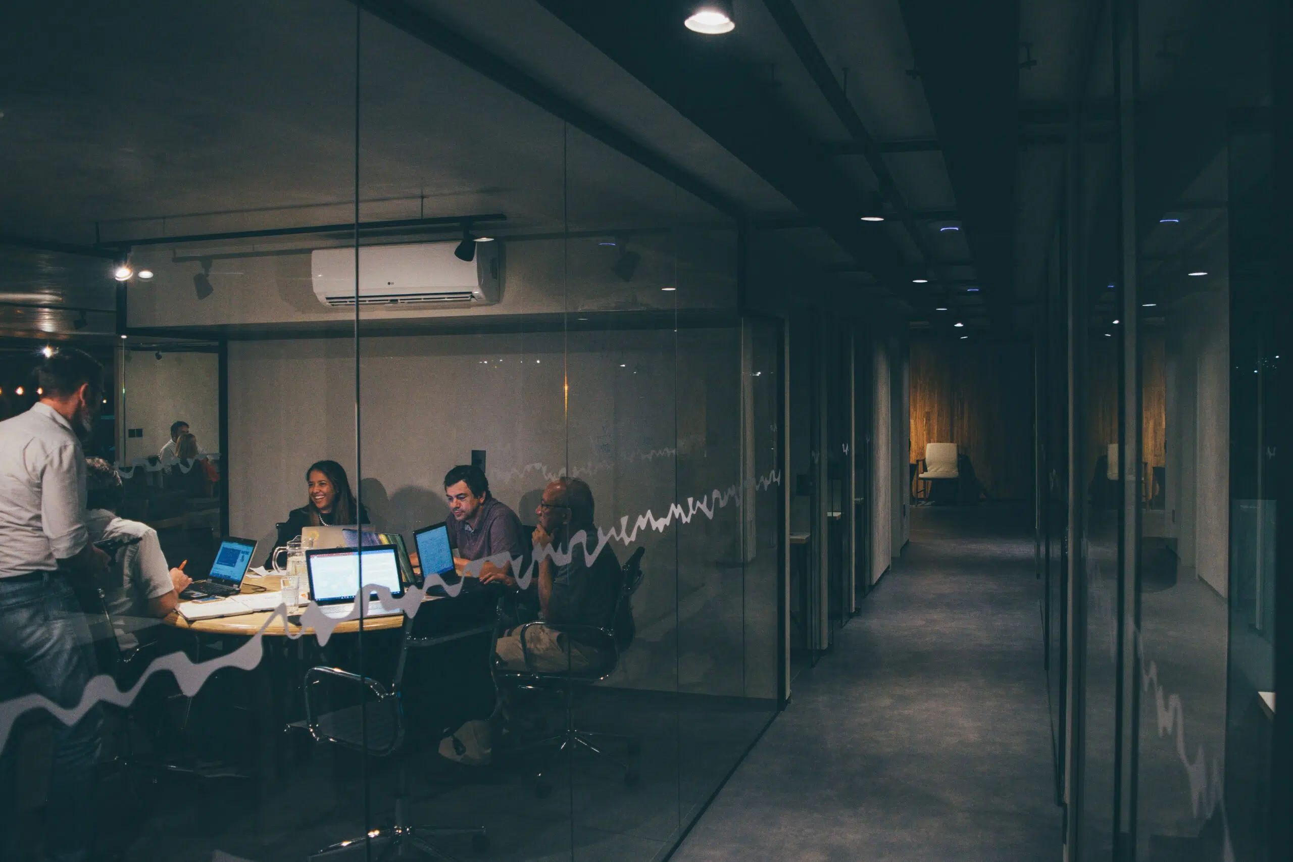 team meeting in an office | Cohesion team meeting in an office