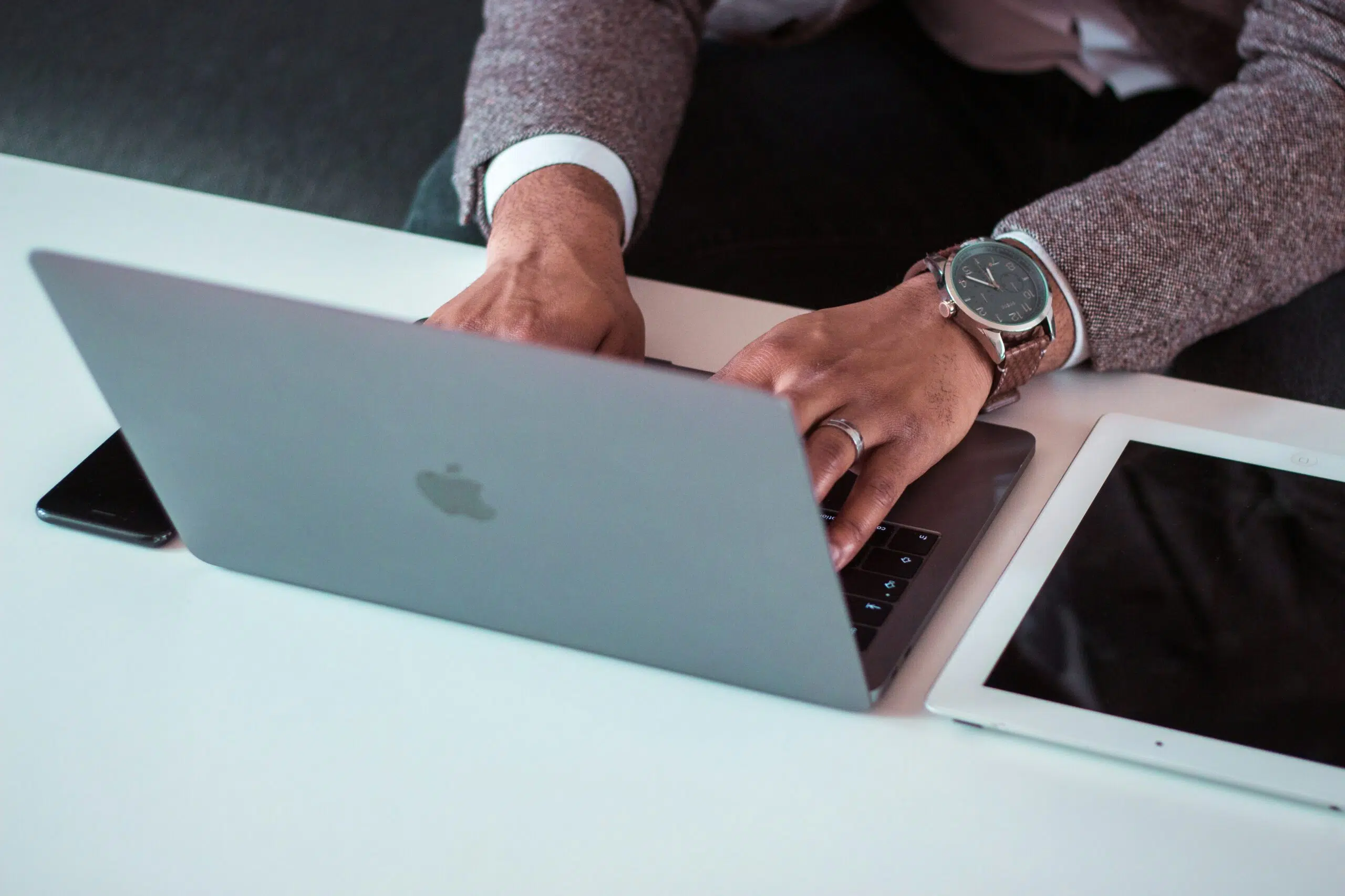 a business professional working on a laptop | Cohesion a business professional working on a laptop