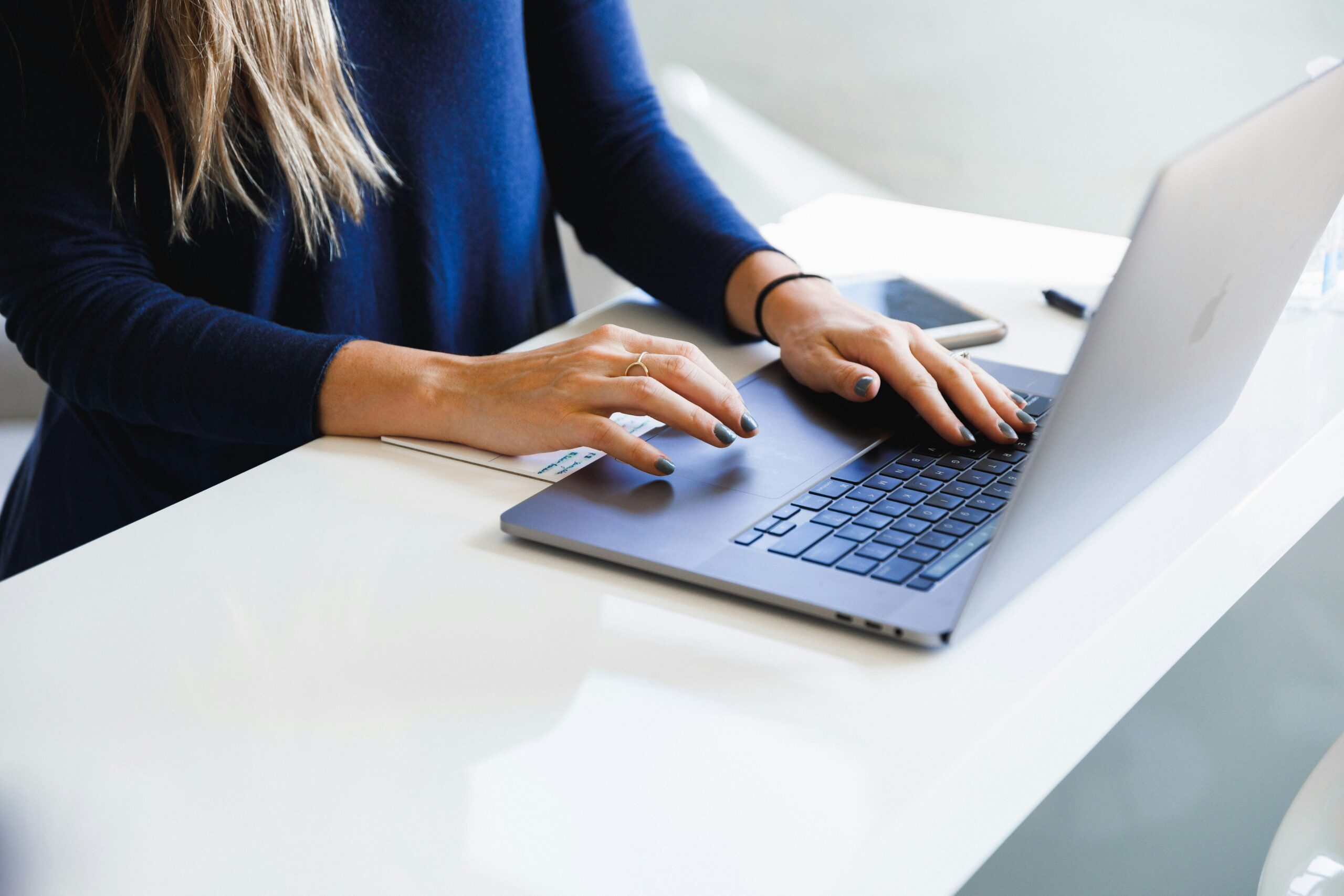 a woman using her laptop | Cohesion a woman using her laptop