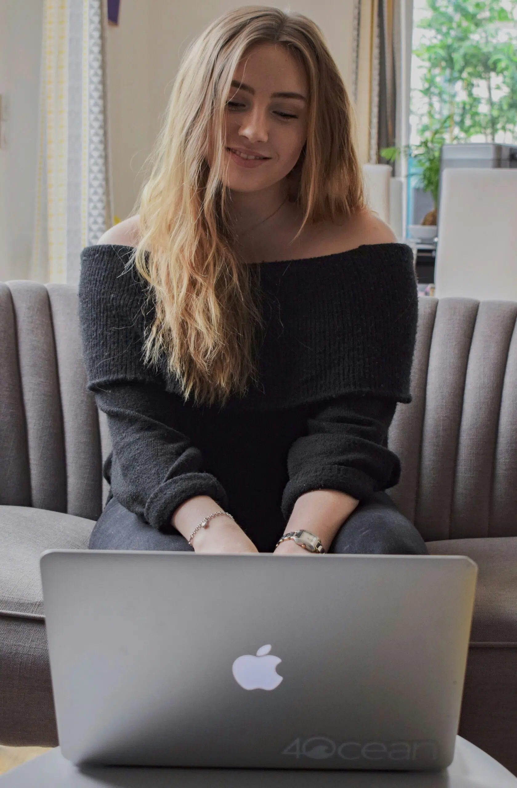 a small business owner working on her laptop | Cohesion a small business owner working on her laptop