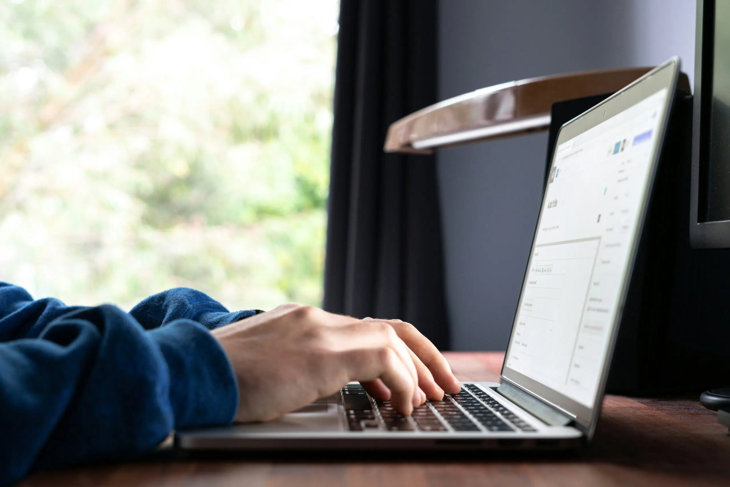a person using their laptop | Cohesion a person using their laptop