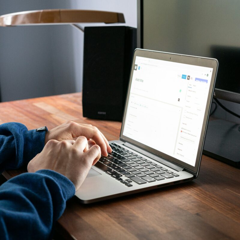 a person typing on a keyboard