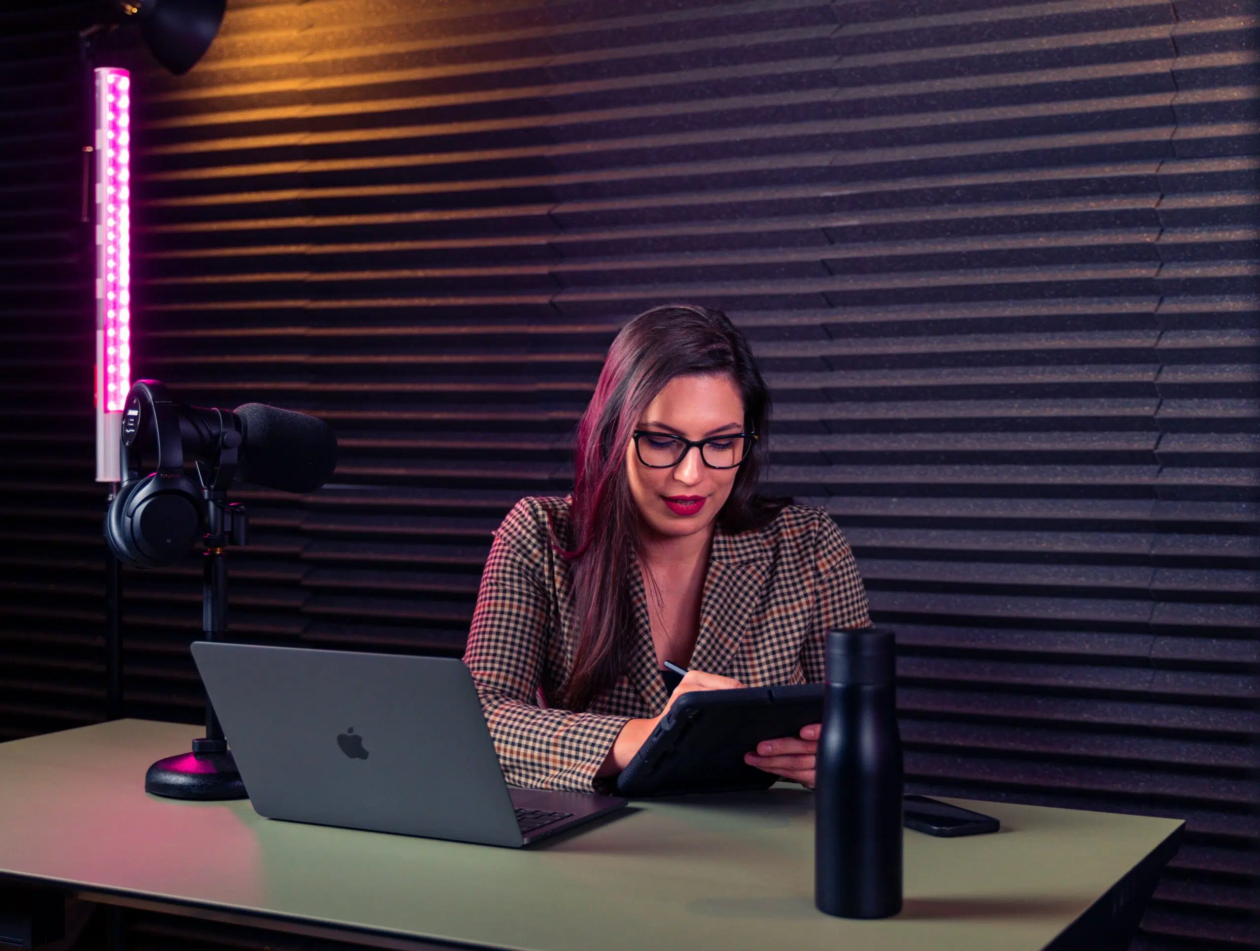 a small business owner using accounting software on her ipad | Cohesion a small business owner using accounting software on her ipad