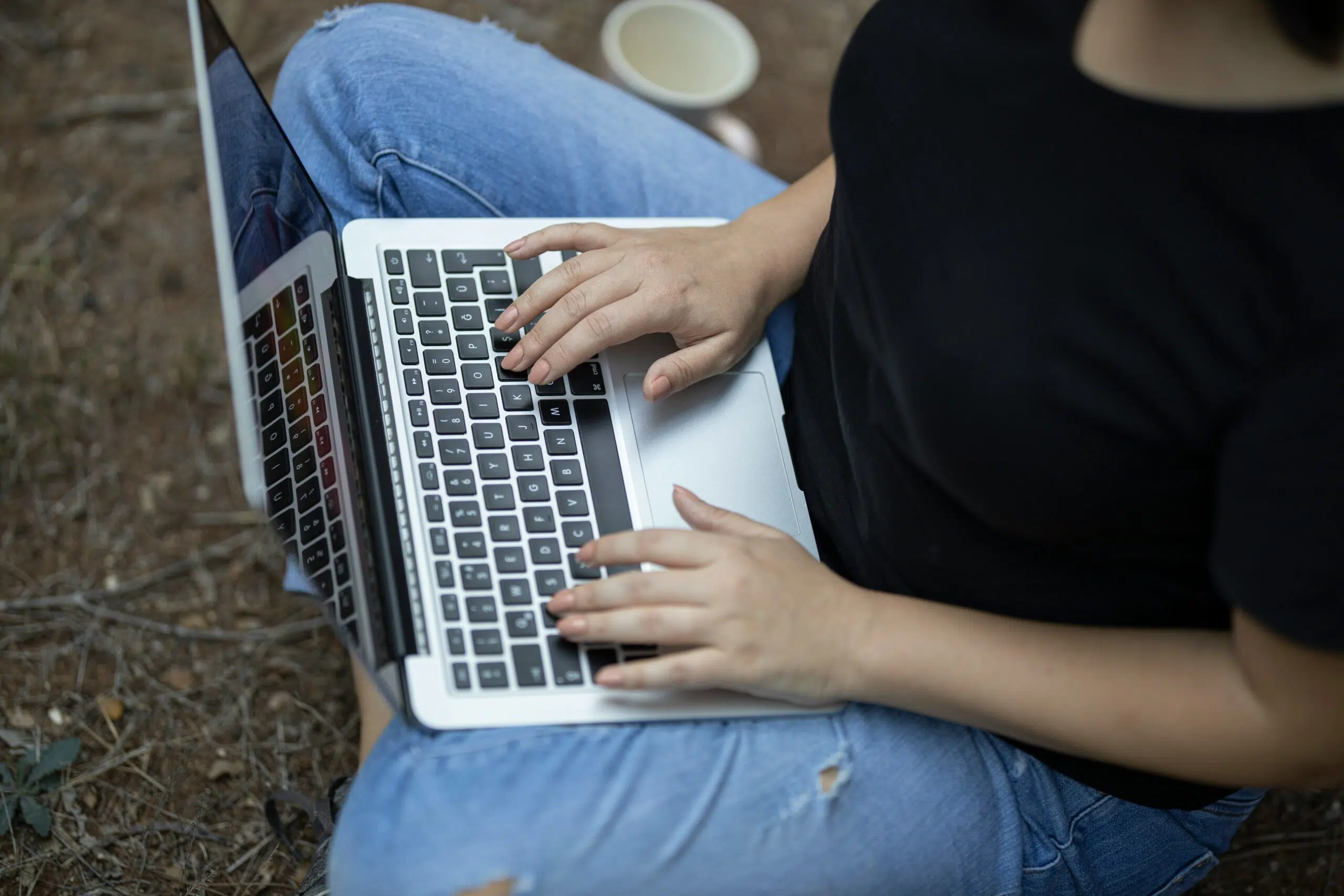 a Dallas tech founder using her laptop | Cohesion a Dallas tech founder using her laptop